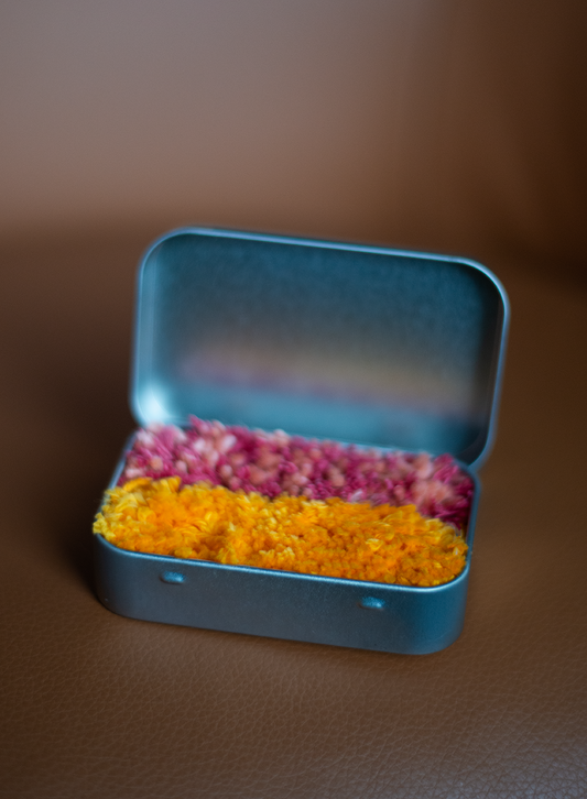 Pink and Yellow Rug in a Tin